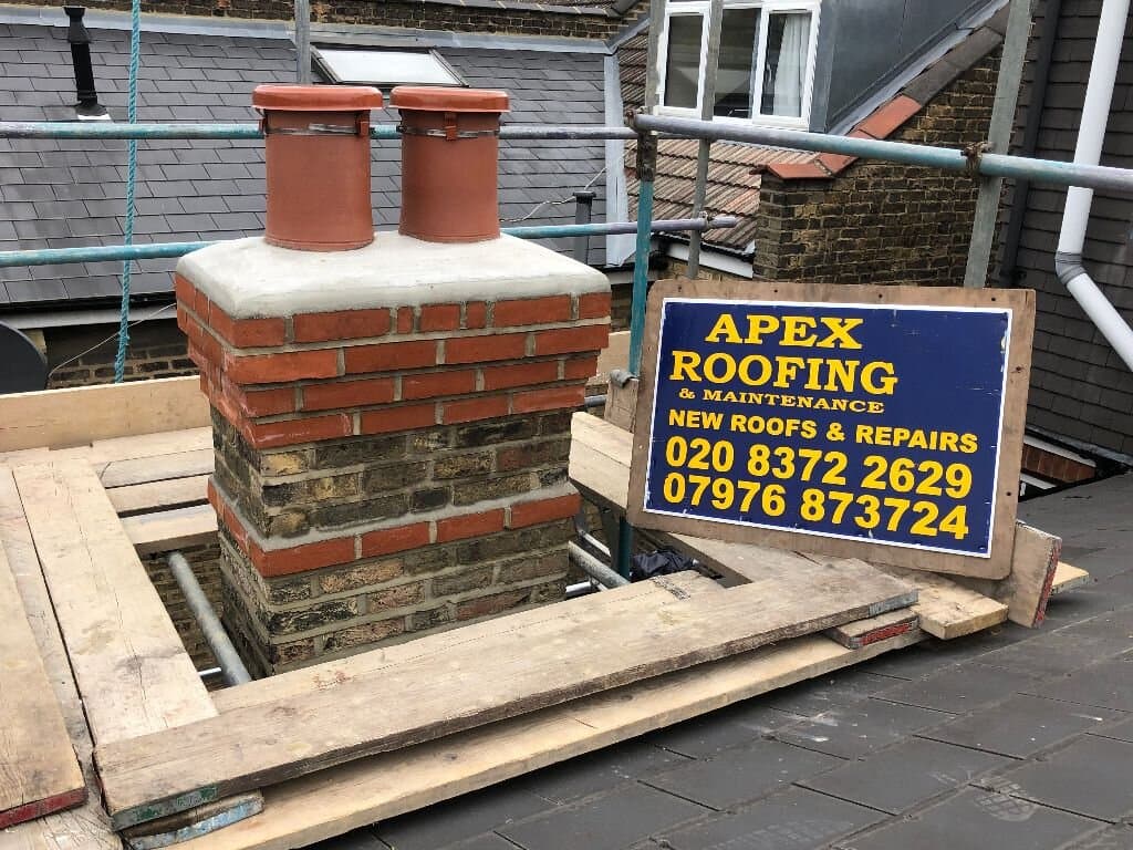 Chimney works in progress with branded site board