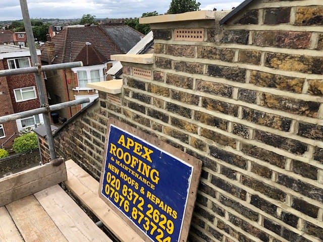 Lead flashing renewed around a stepped chimney base