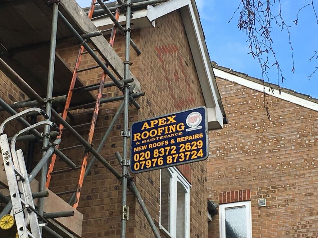 Scaffold setup for roof and chimney repairs